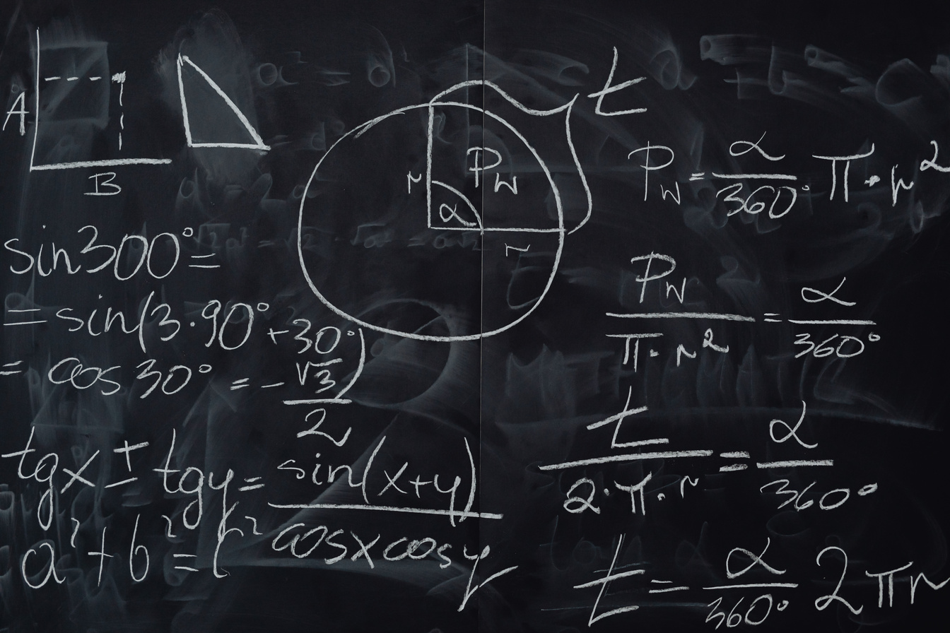 Blackboard with Handwritten Calculations